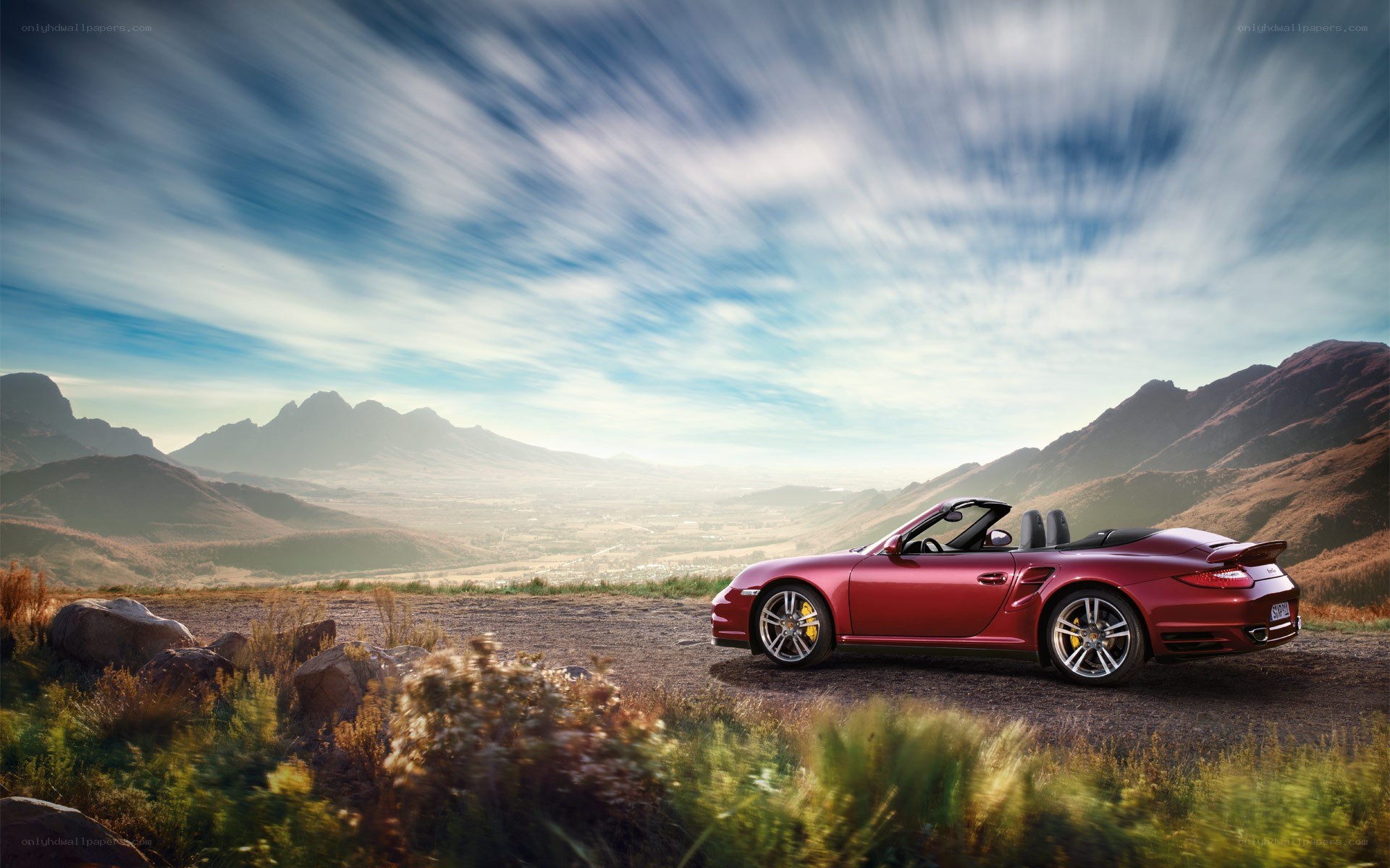 Red Porsche on a mountain road