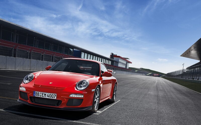 Red Porsche on a racetrack