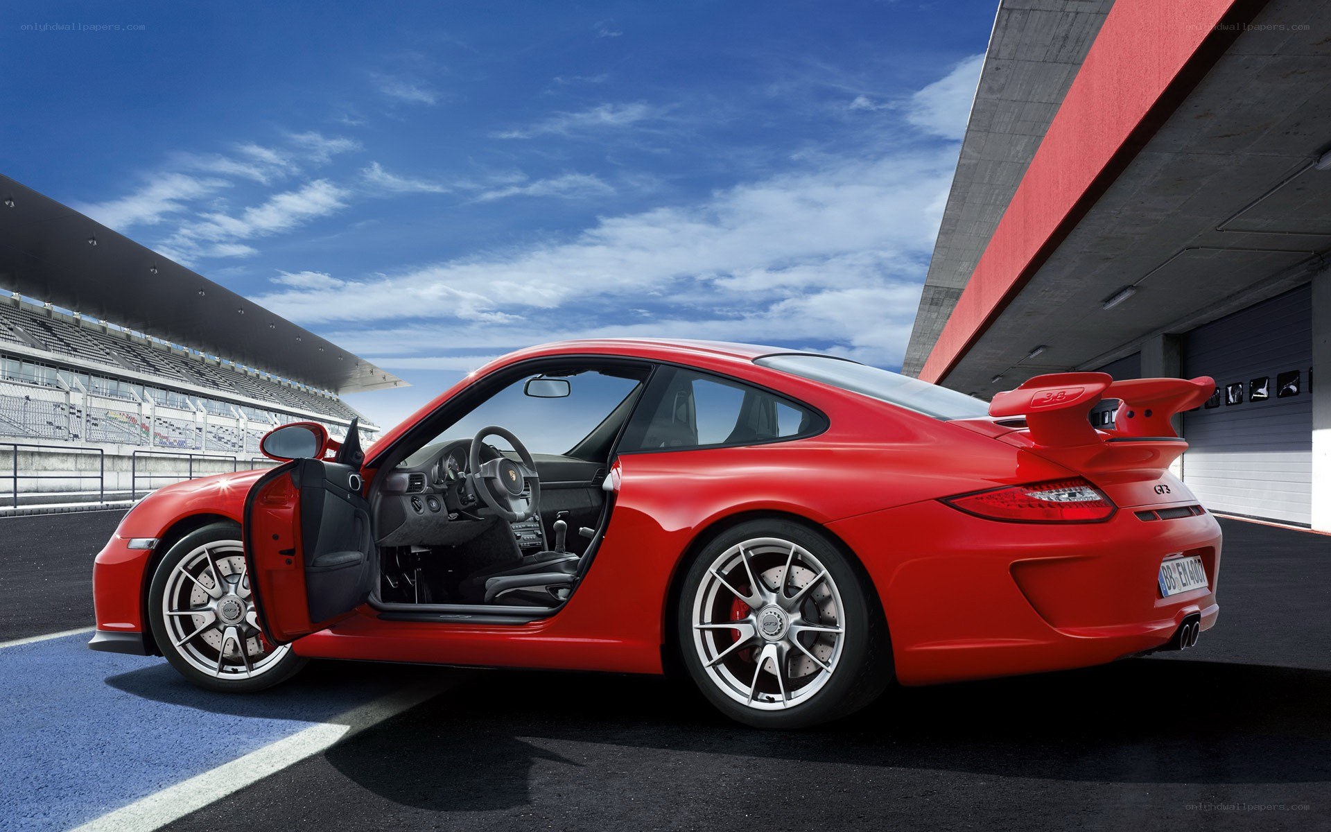 Red Porsche on a racetrack