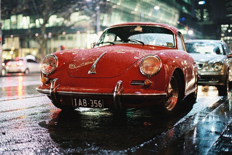 Red Porsche on a rainy night
