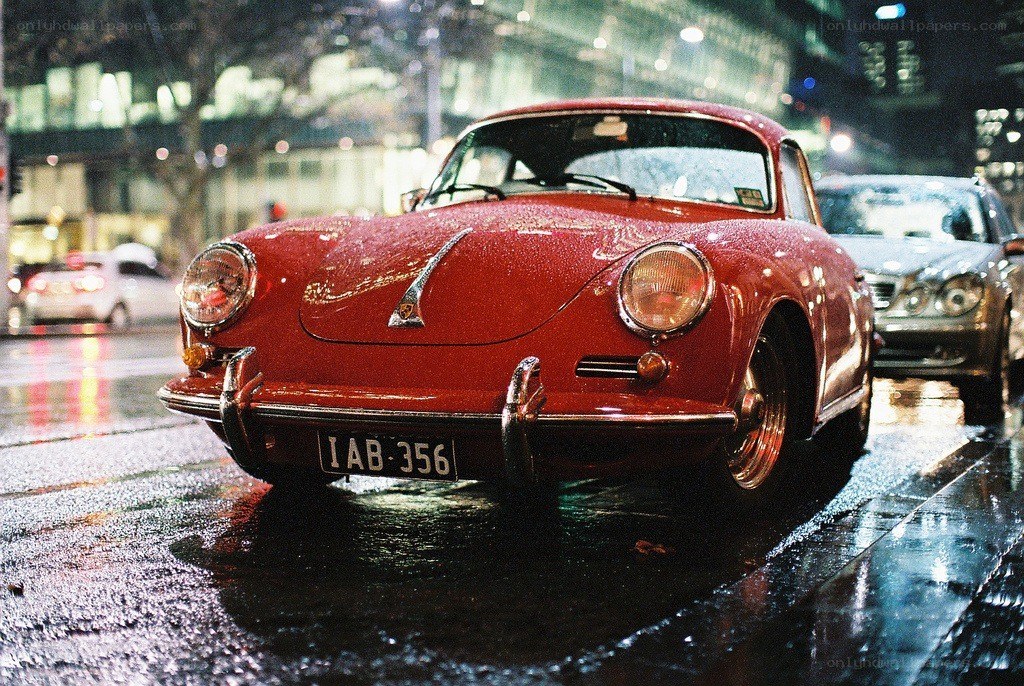 Red Porsche on a rainy night