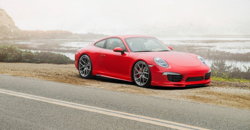 Red Porsche on coastal road