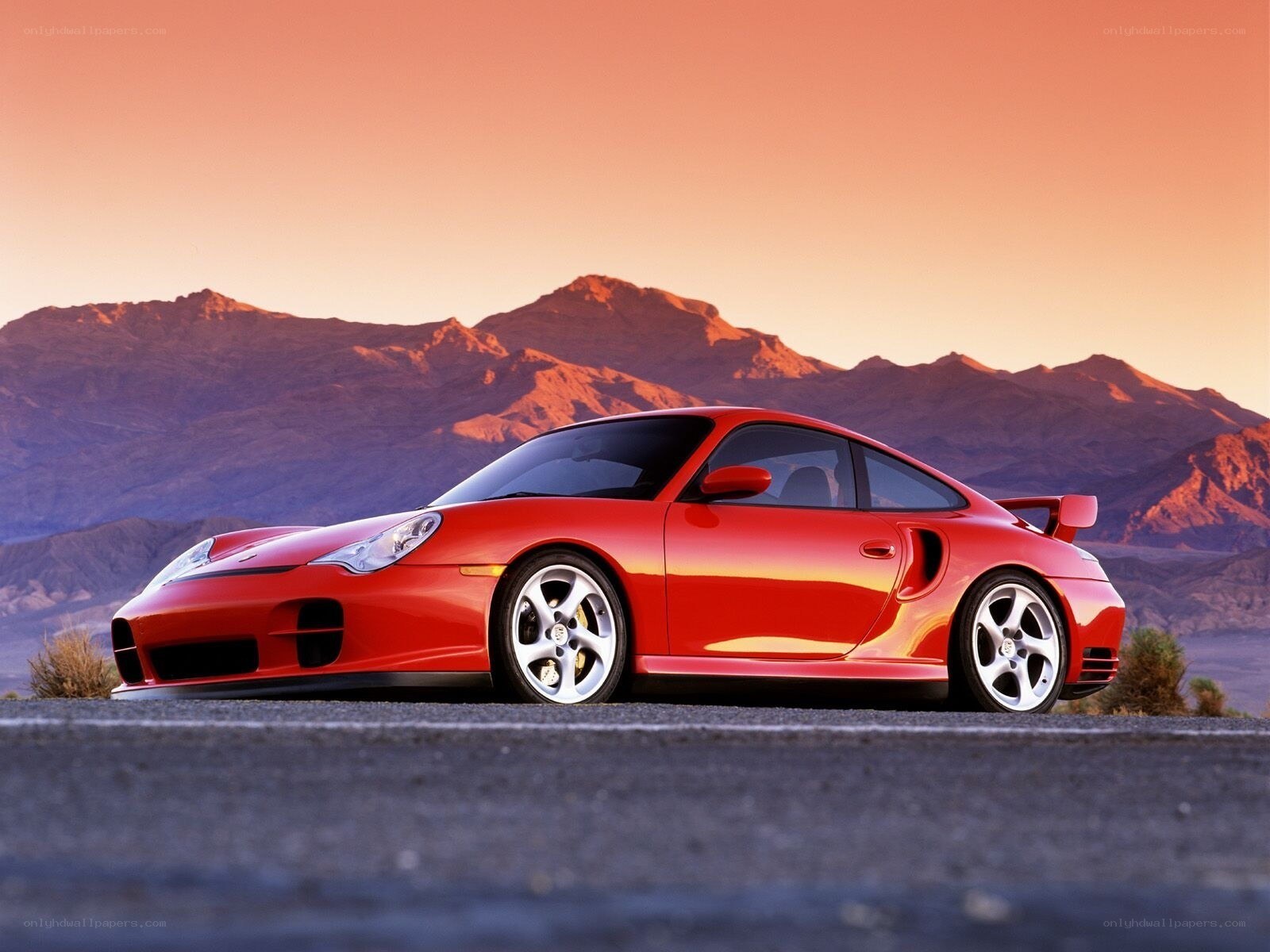 Red Porsche on desert road
