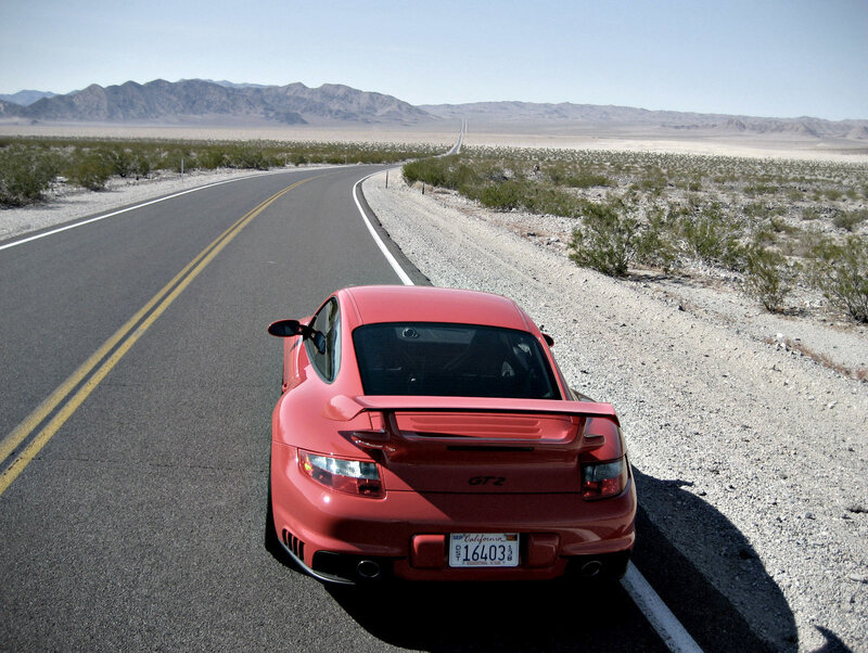 Red Porsche on desert road