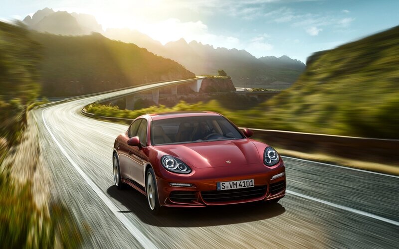 Red Porsche on mountain road