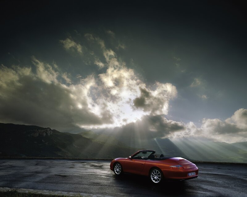 Red Porsche on mountain road