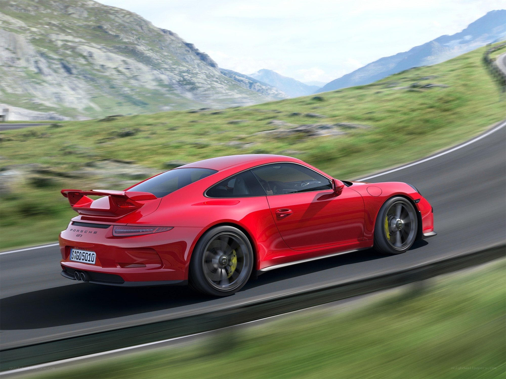 Red Porsche on mountain road