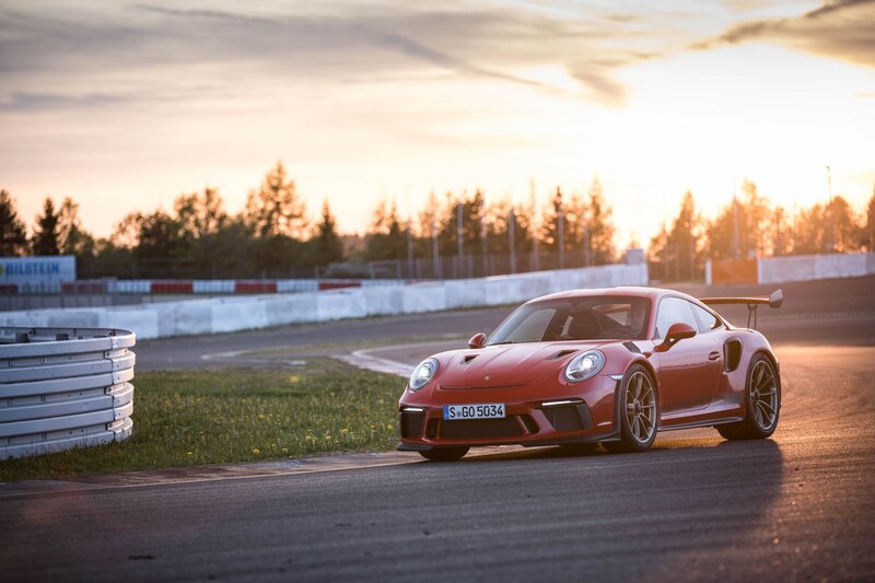 Red Porsche on Racetrack — Dramatic