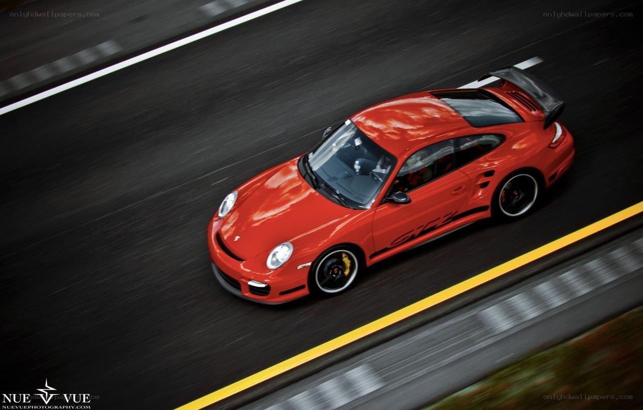 red porsche on racetrack
