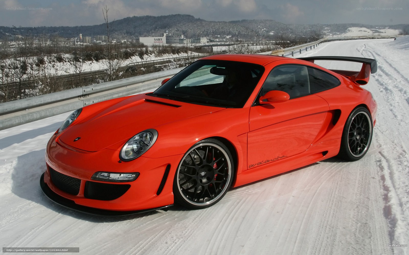 Red Porsche on snowy road