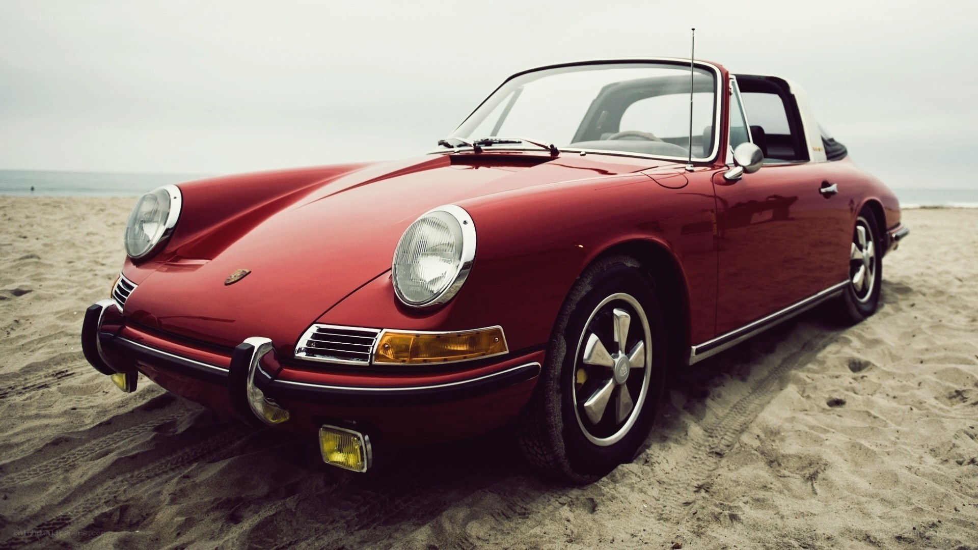 Red Porsche on the beach
