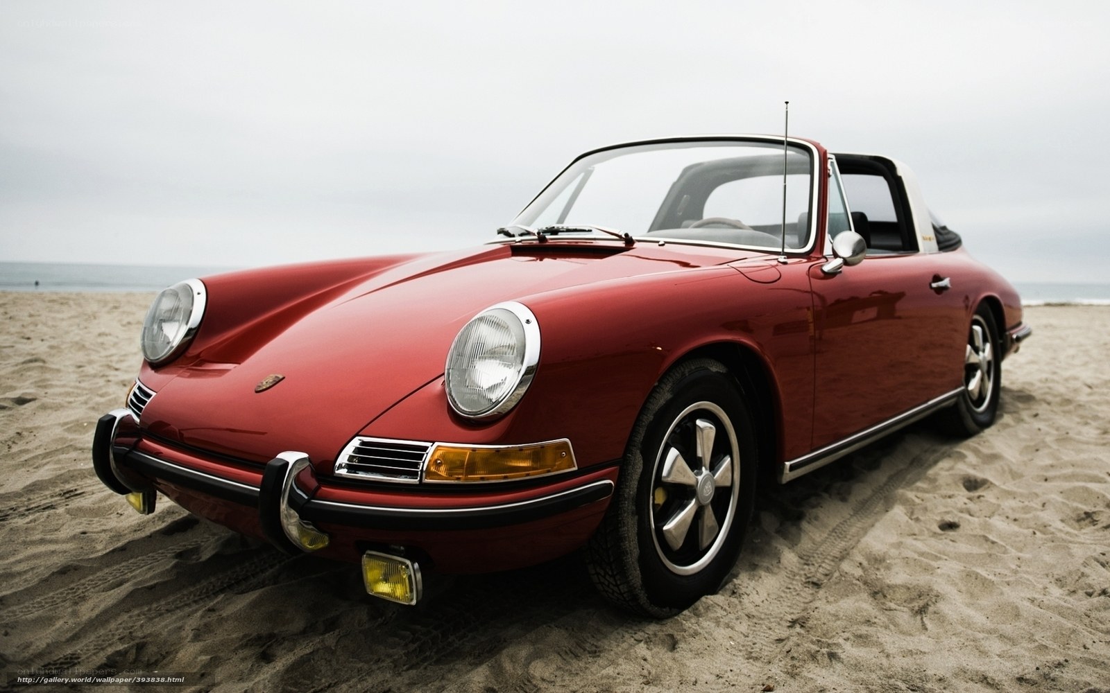 Red Porsche on the beach