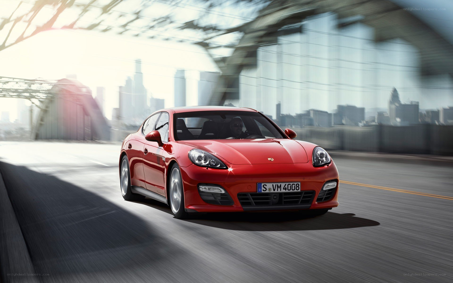 Red Porsche Panamera in motion