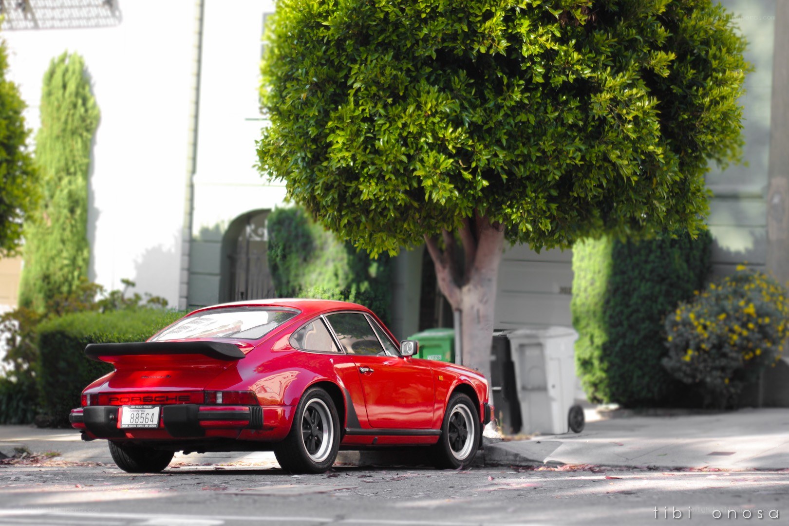 Red Porsche parked on a street