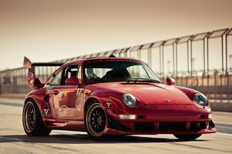 Red Porsche race car on track
