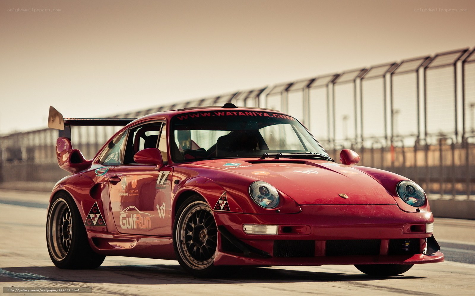 Red Porsche race car on track