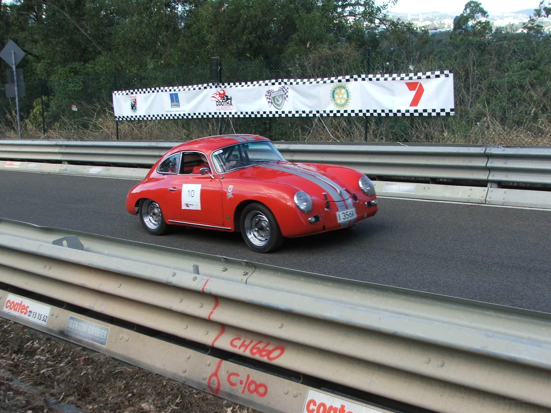 Red Porsche racing on track