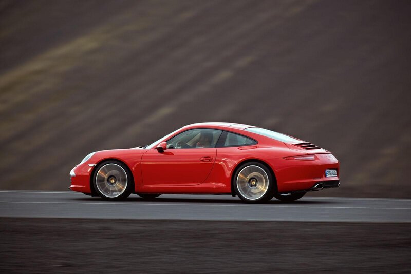 Red Porsche sports car in motion