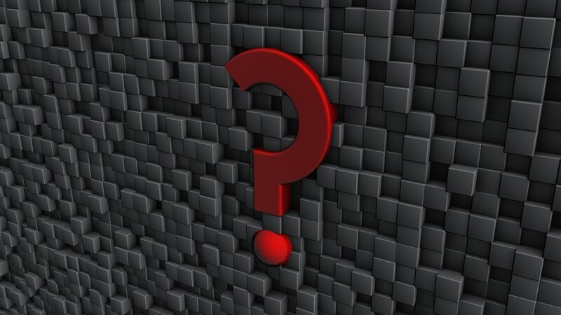 Red question mark on cube wall