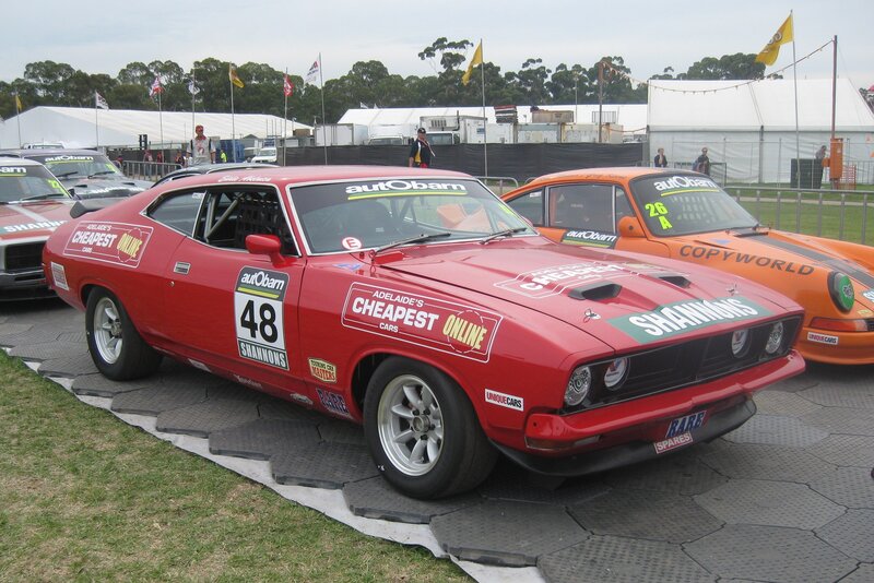 Red race car at a motorsport event