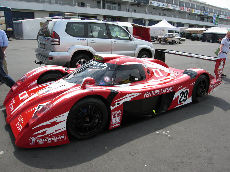 Red race car at a track