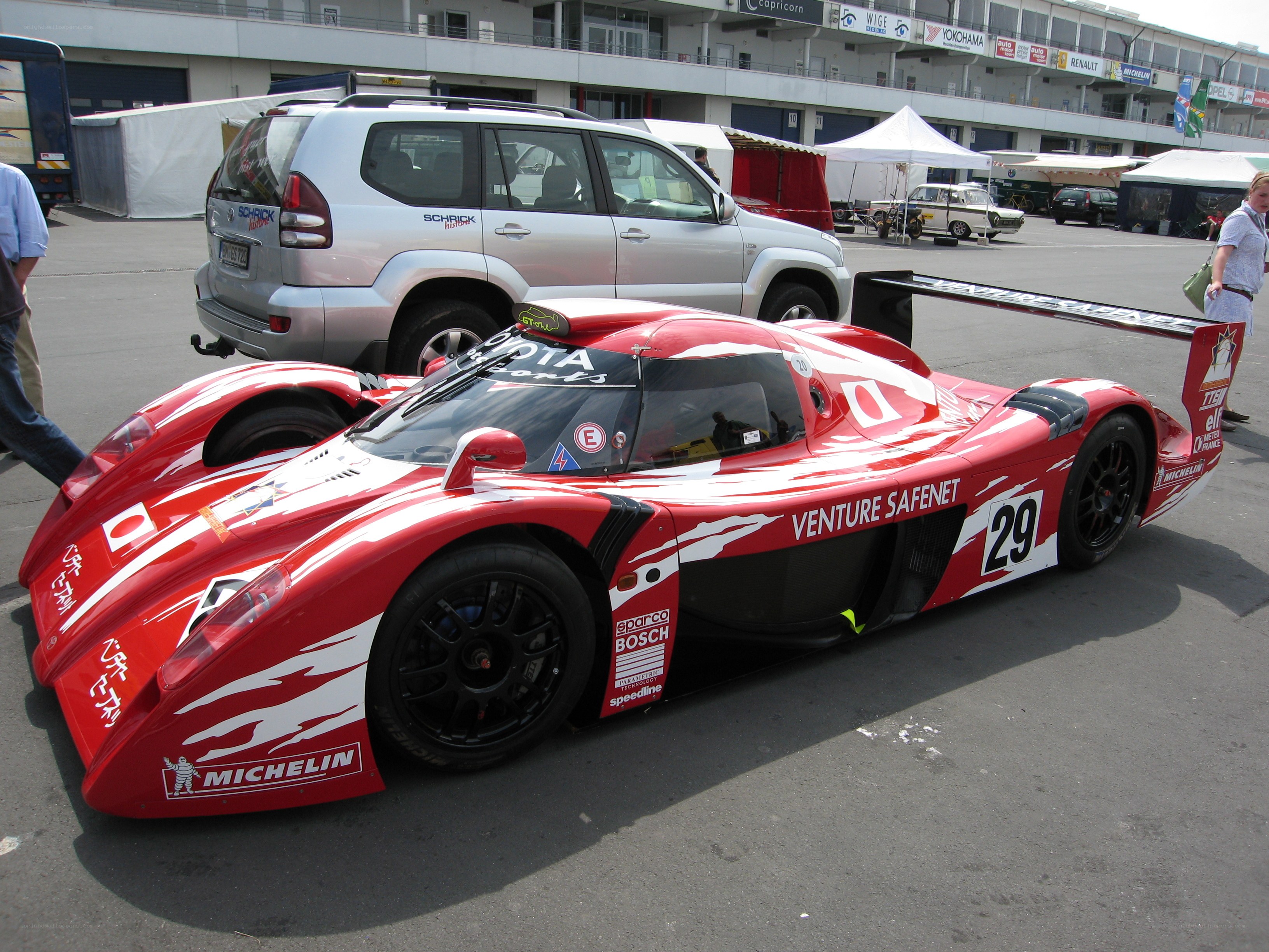 Red race car at a track