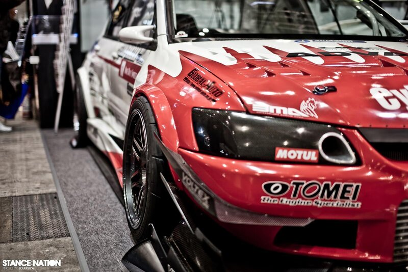 red race car at an auto show