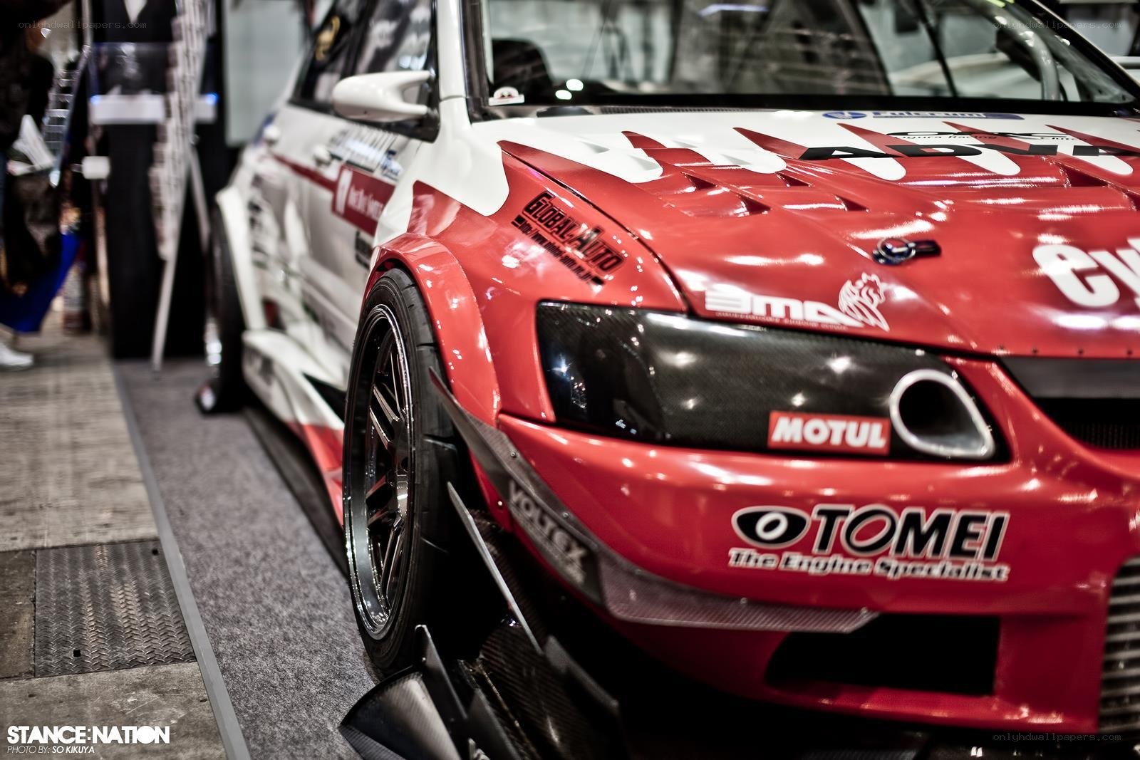red race car at an auto show