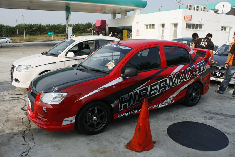 Red race car at gas station