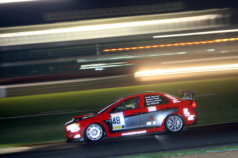Red race car at night