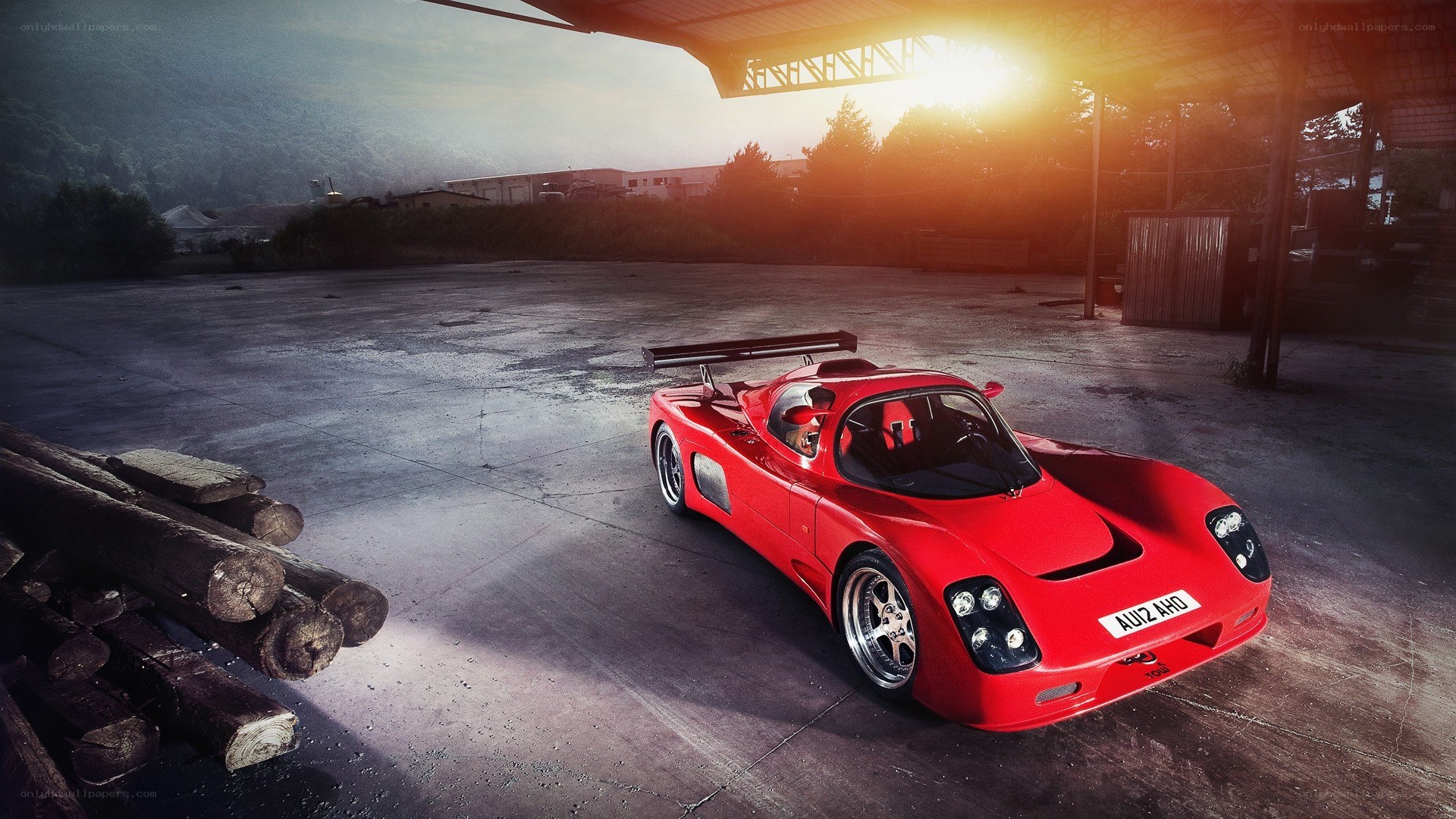 Red race car at sunset