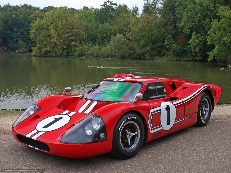 Red race car by a lake