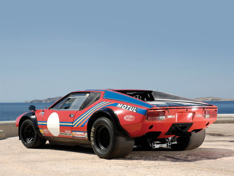 Red race car by the sea