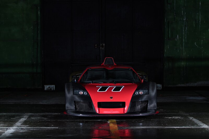 Red Race Car — Dramatic, Night, Photograph, Garage, Wet Floor, Black, Green