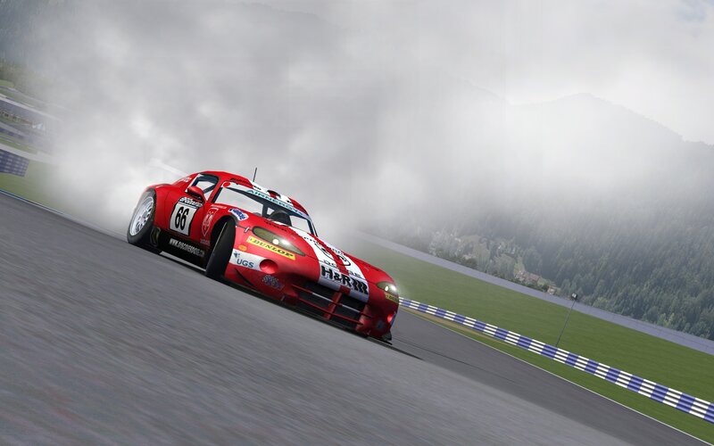 Red race car drifting on track