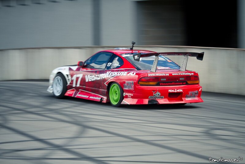 Red race car drifting