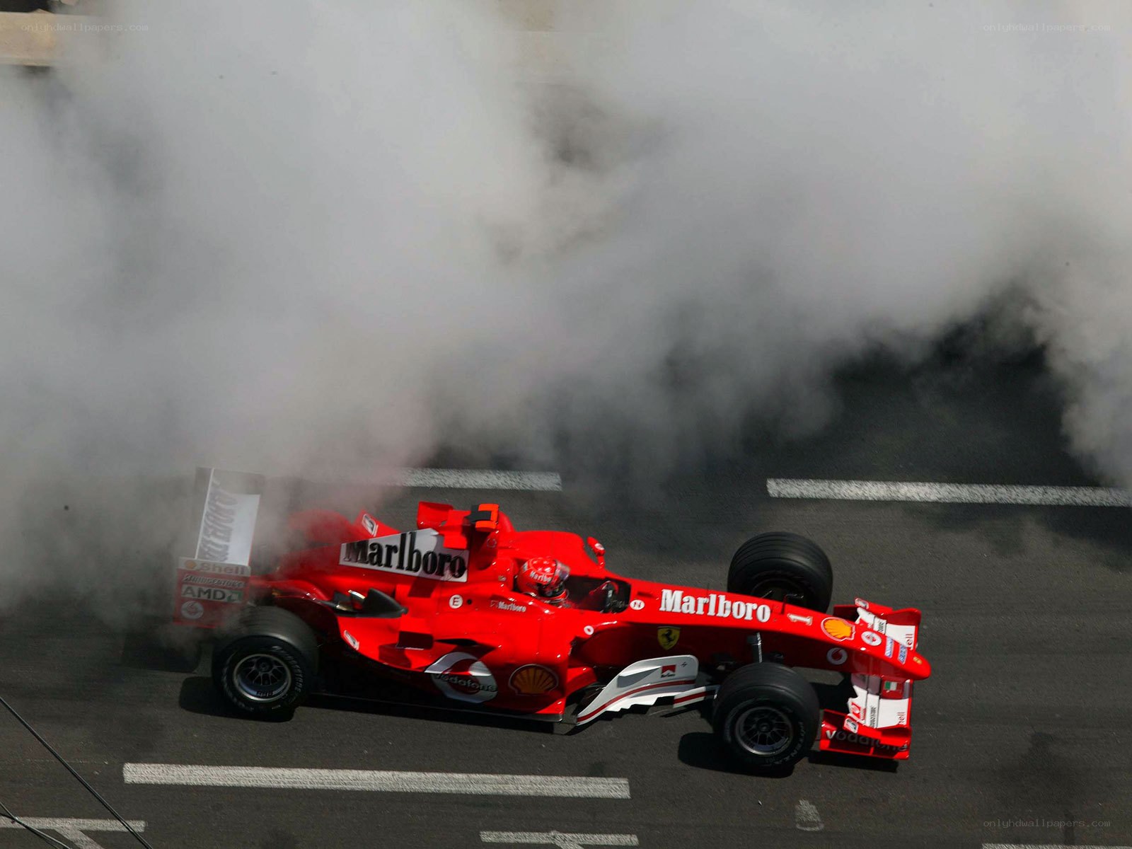 Red race car emitting smoke