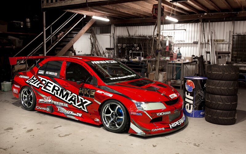Red Race Car in Garage — Industrial, Photograph