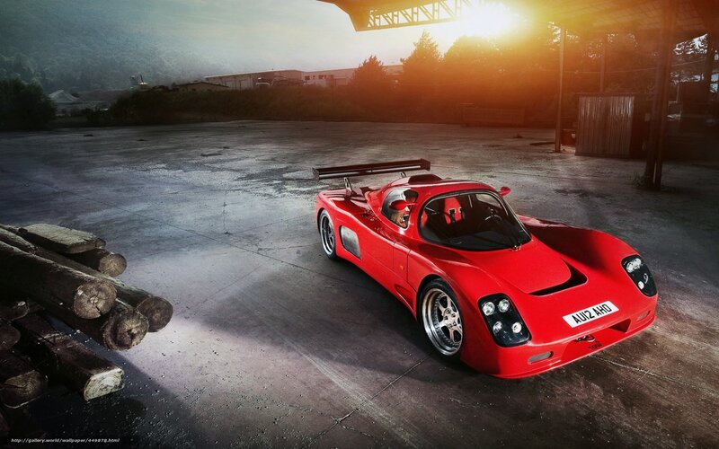 Red race car in industrial lot