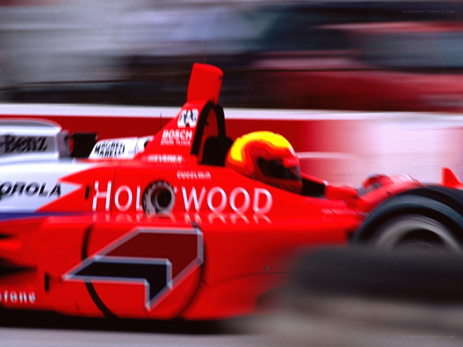 Red race car in motion