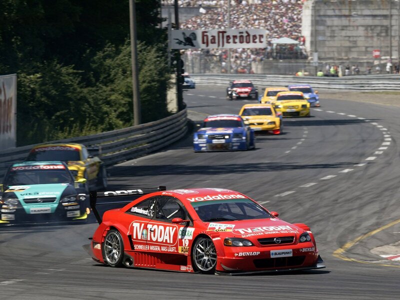 Red race car leading a pack