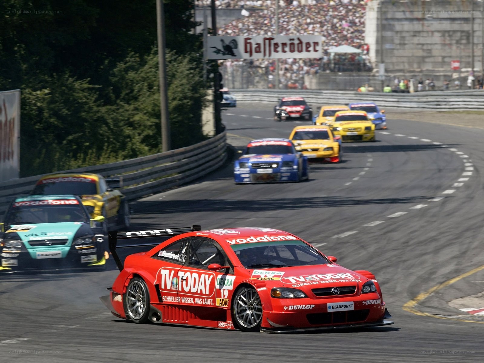 Red race car leading a pack