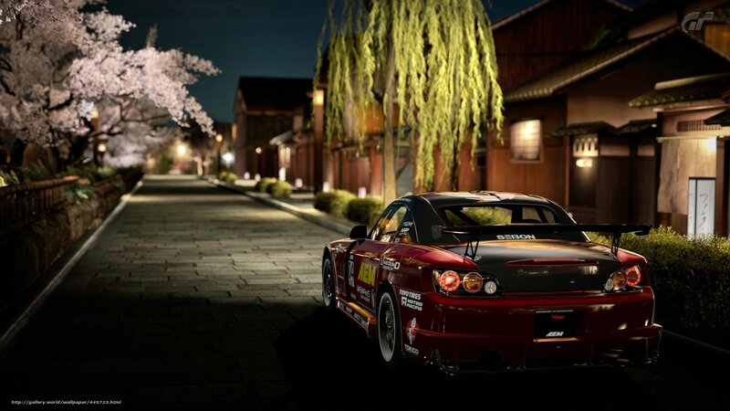 Red race car on a cherry blossom street