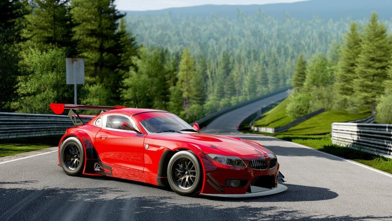 Red race car on a forest track