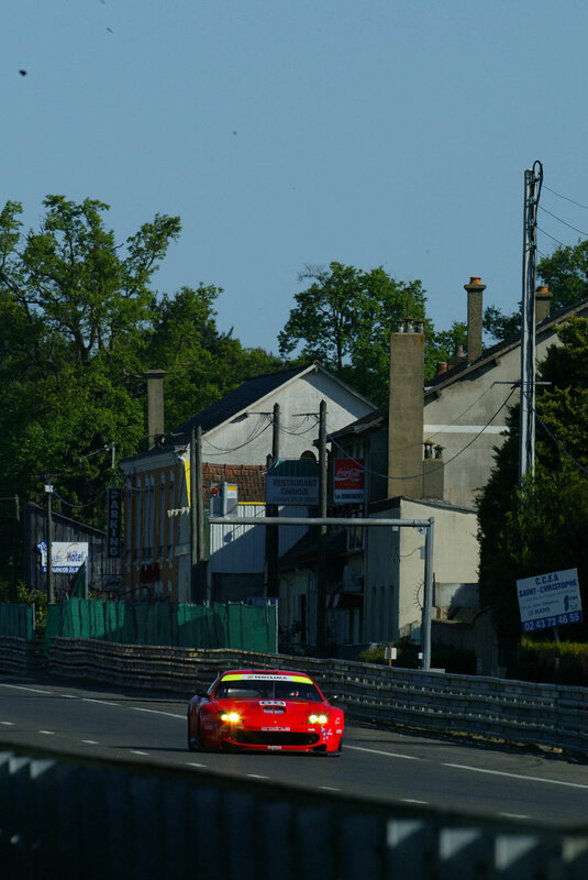 Red race car on a street circuit