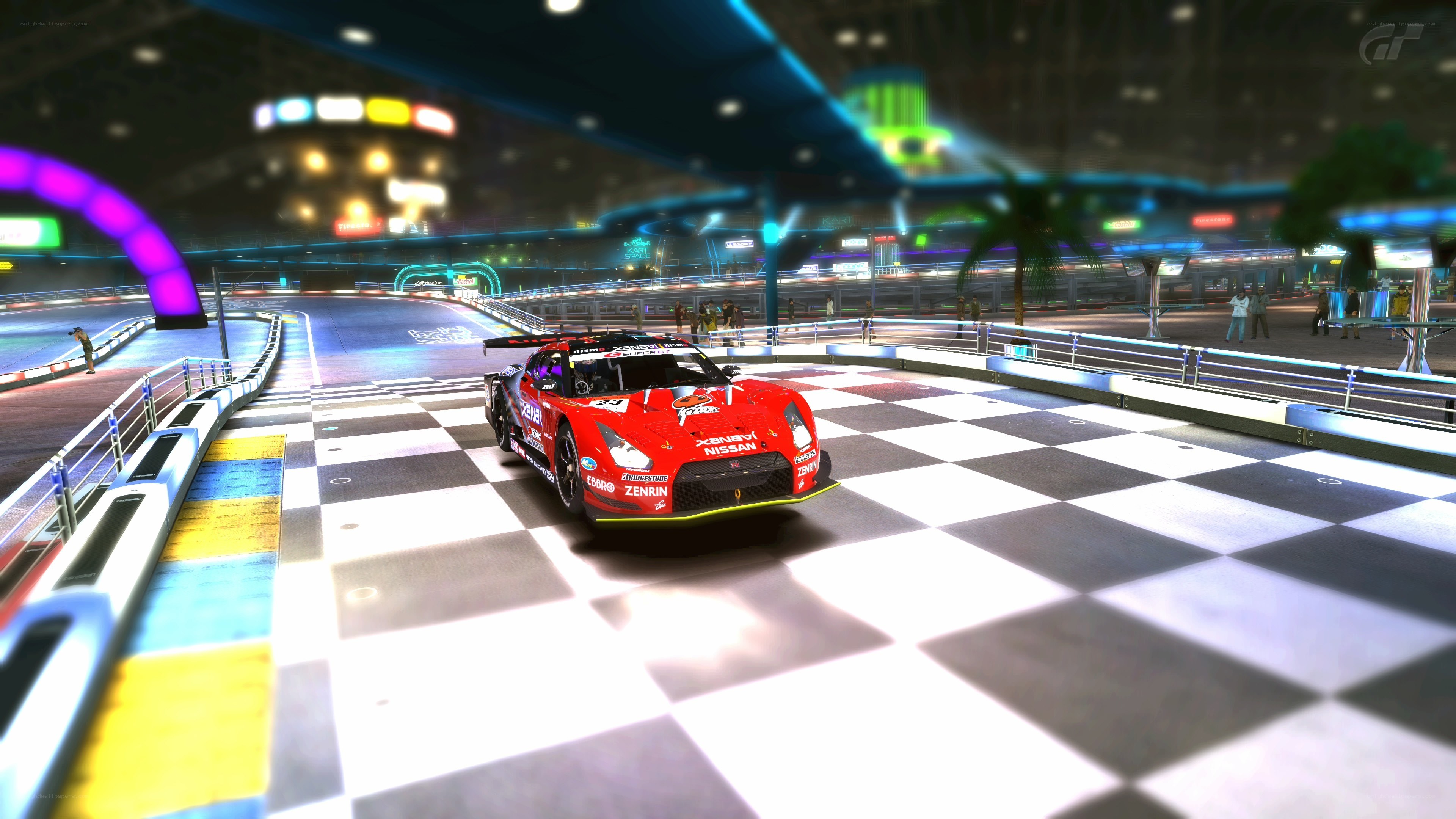 Red race car on checkered track
