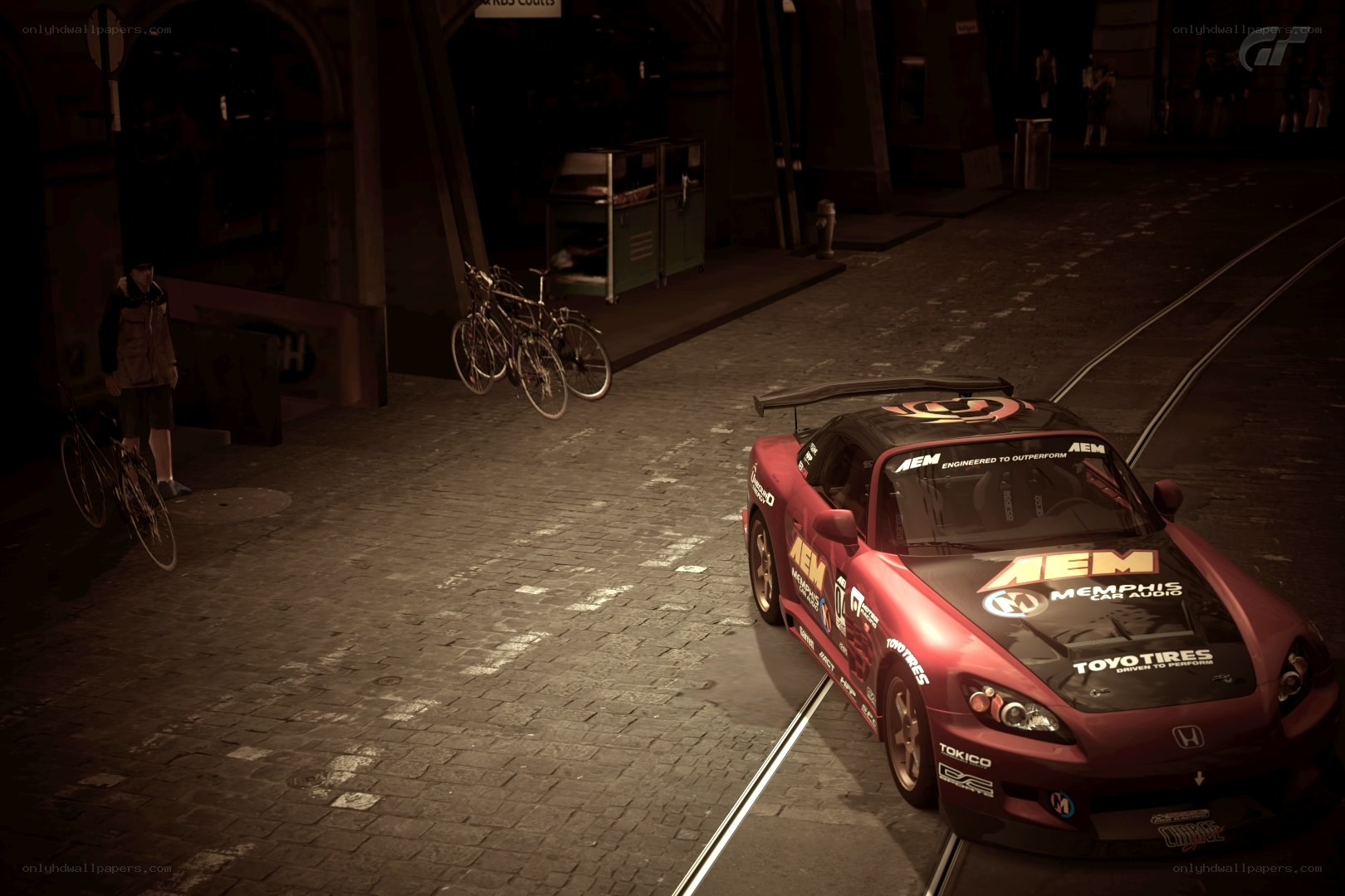 Red race car on cobblestone street