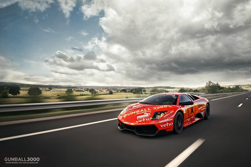 Red race car on country road