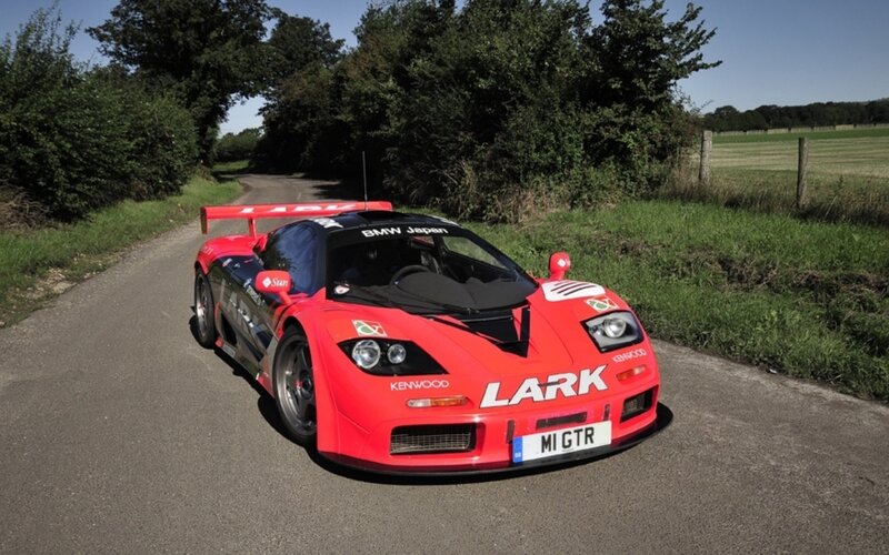 Red race car on country road
