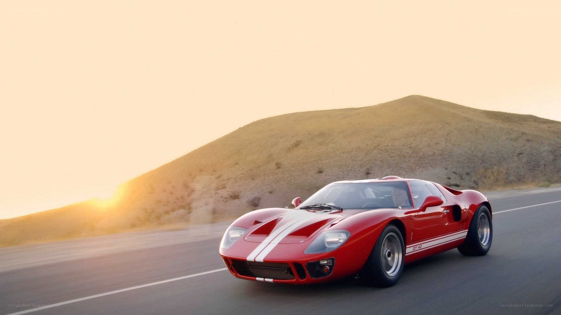 Red race car on desert road
